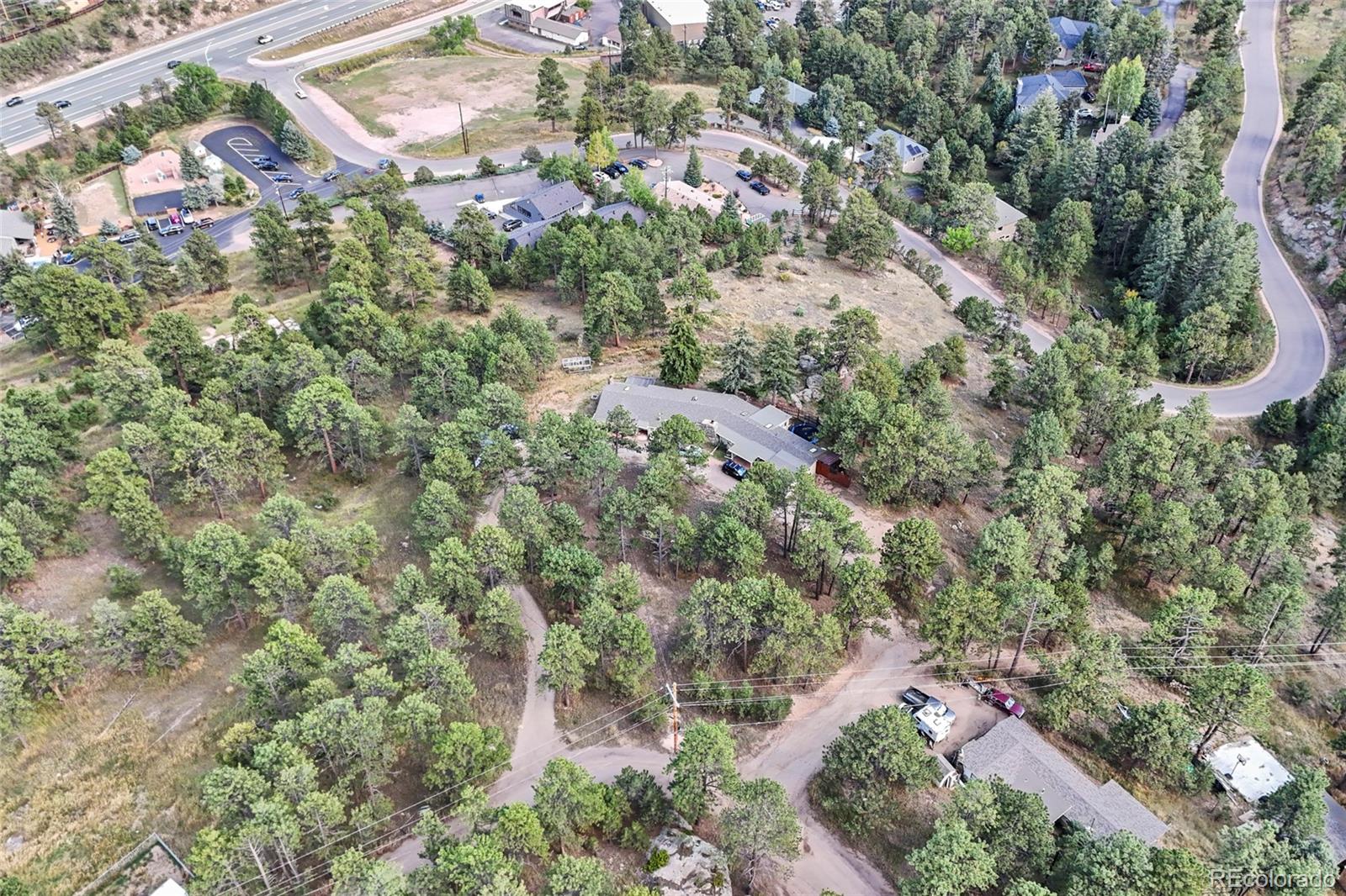 3942 Palo Verde Road Evergreen, CO 80439 - Photo 25 of 41 an aerial view of residential house with green space and trees all around