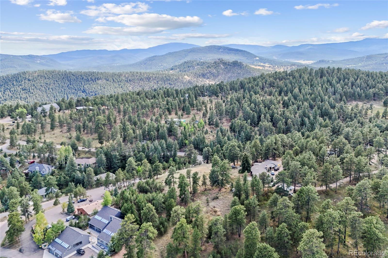 3942 Palo Verde Road Evergreen, CO 80439 - Photo 7 of 41 a view of a city with lush green forest