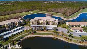8600 Cedar Hammock Circle, Unit 1325 Naples, FL 34112 - Photo 1 of 5 a view of a lake with a garden