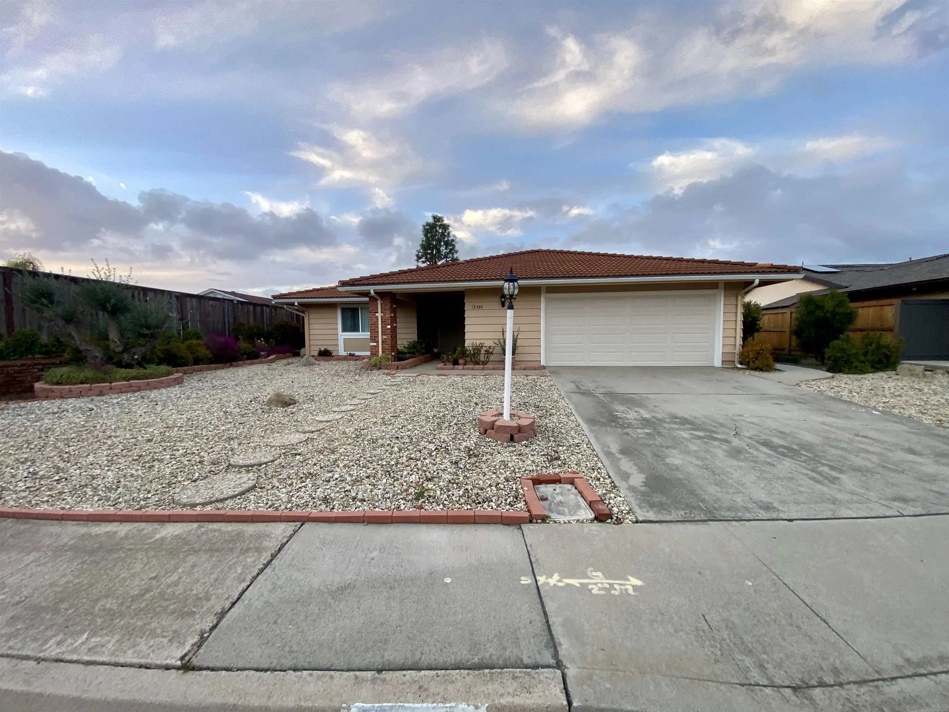 12608 Mantilla Road San Diego, CA 92128 - Photo 37 of 37 a front view of a house with a yard and garage