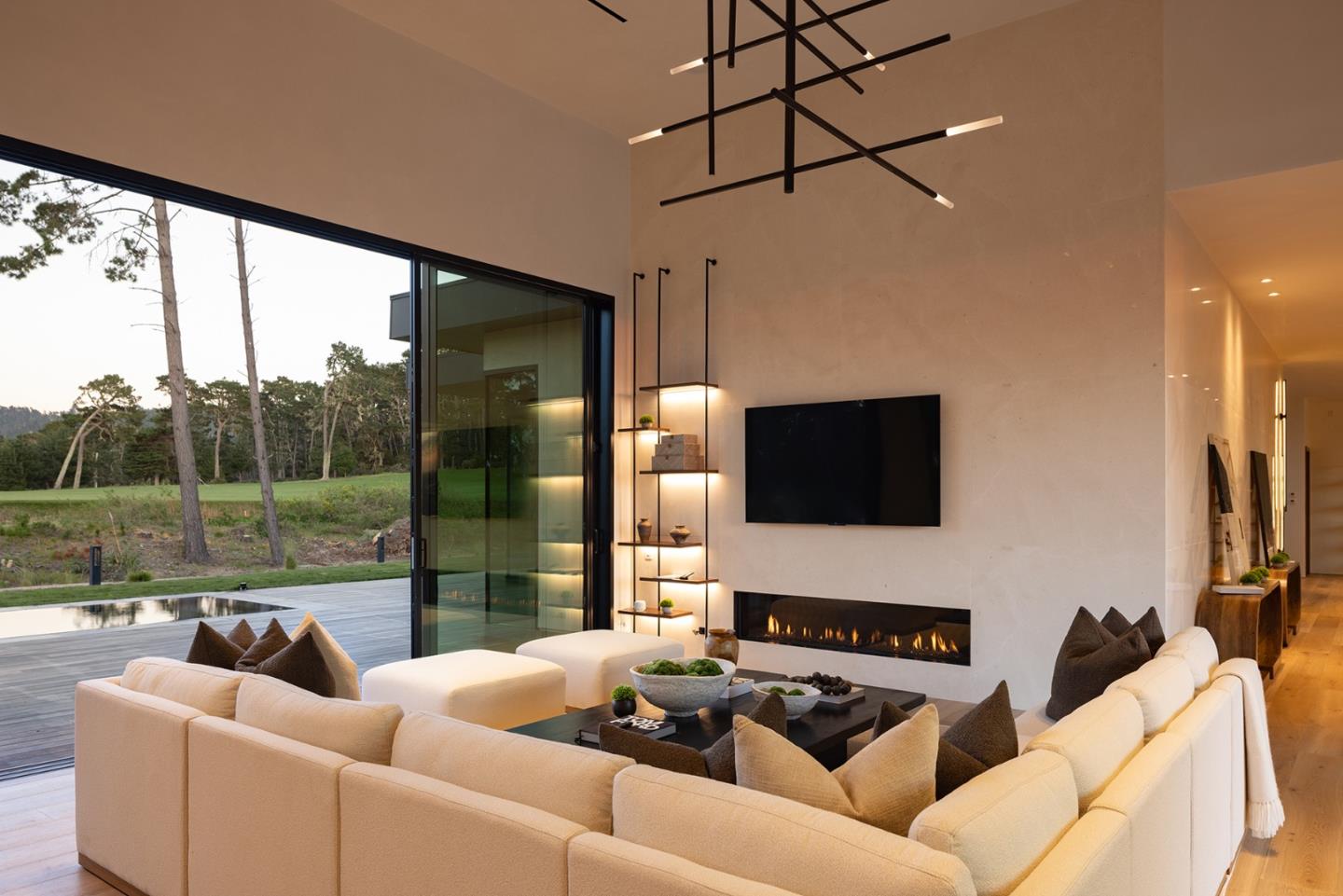31 Poppy Lane Pebble Beach, CA 93953 - Photo 11 of 45 a living room with furniture a flat screen tv and a floor to ceiling window