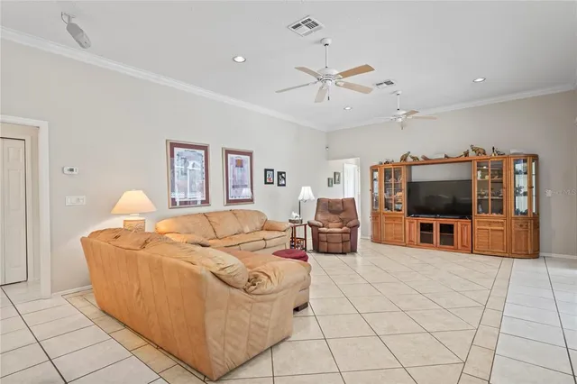 a bedroom with a bed and a television