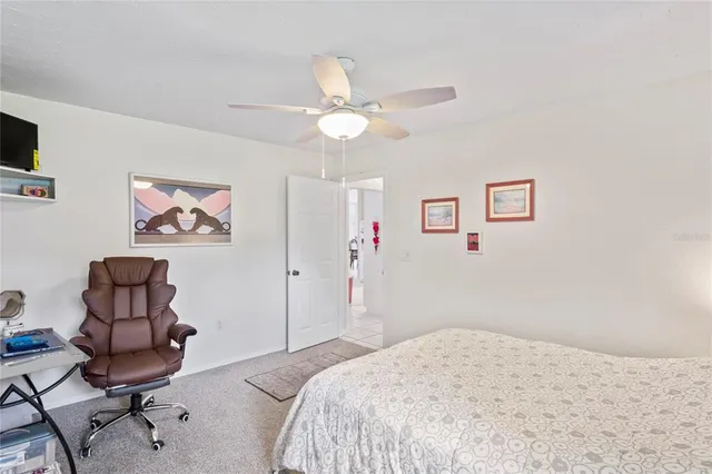 a view of a yard with wooden fence