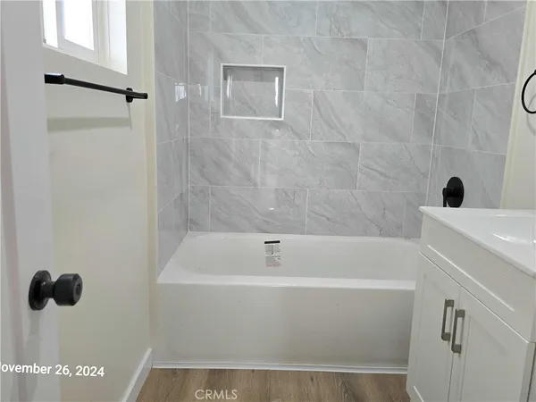 a bathroom with a sink a toilet and bathtub