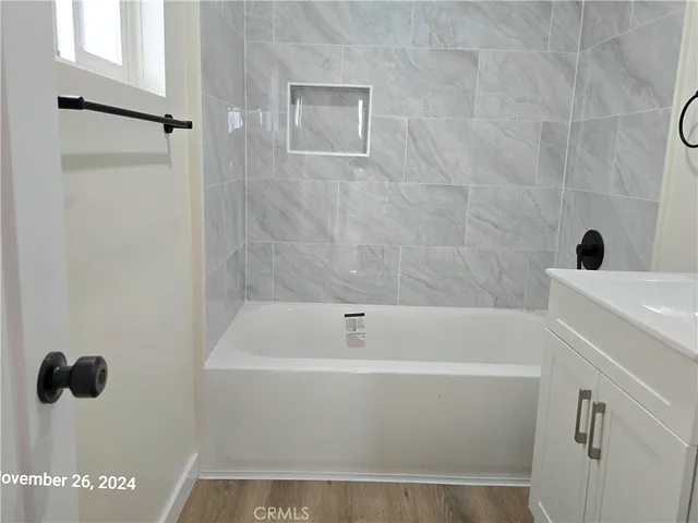 a bathroom with a sink a toilet and bathtub