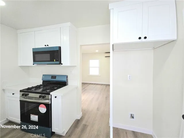 a view of a bathroom with a sink and window