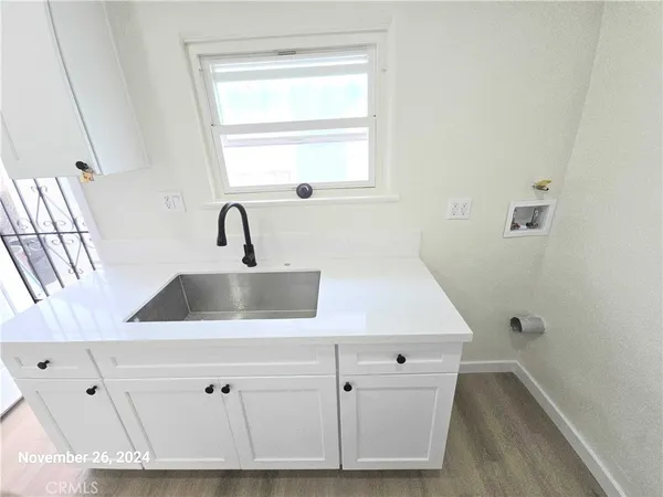 an empty room with wooden floor and closet