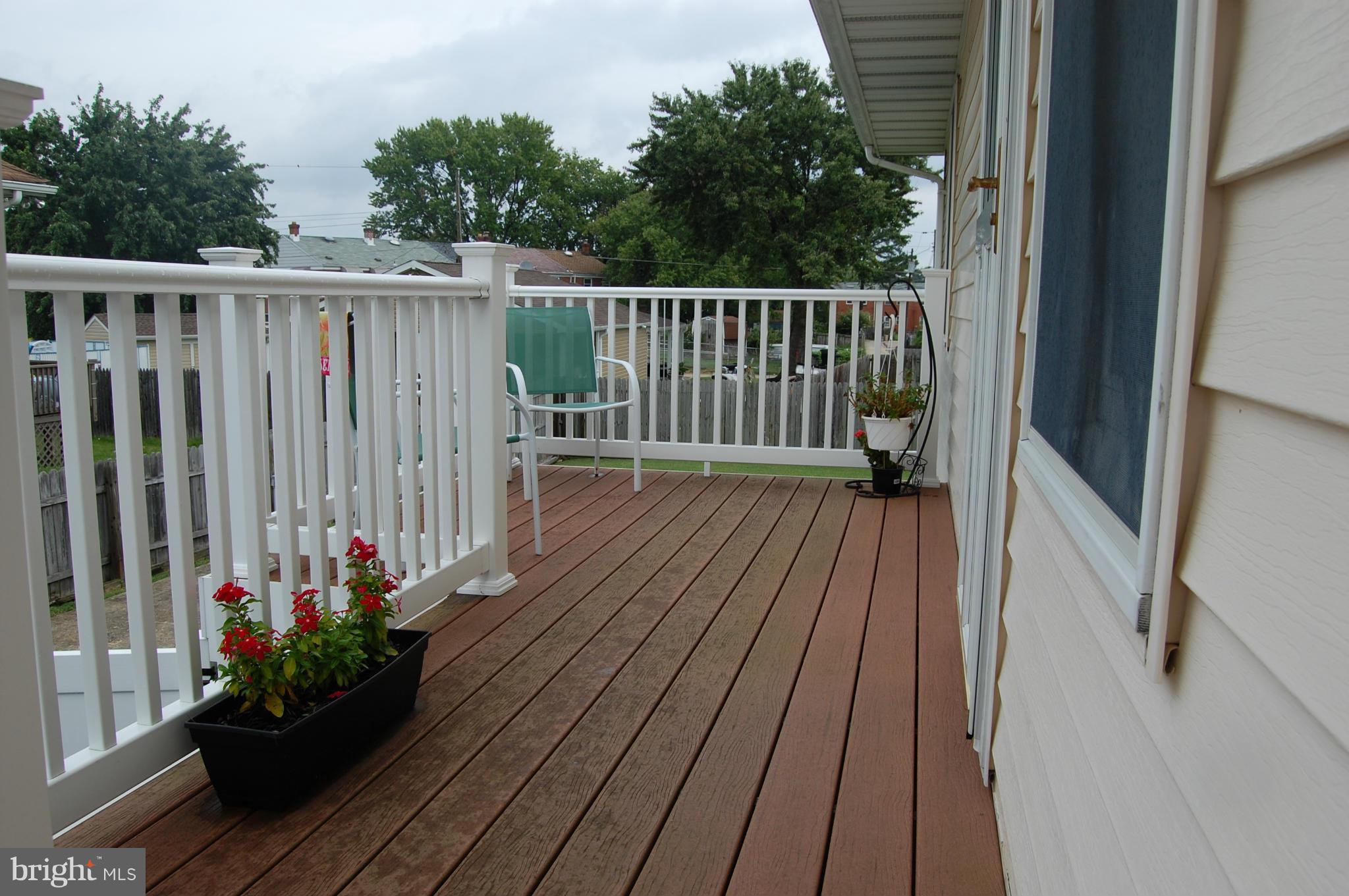 8005 Wallace Road Baltimore, MD 21222 - Photo 3 of 18 a view of a balcony with wooden floor