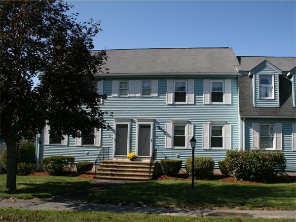96 Century Way, Unit 96 Gardner, MA 01440 - Photo 1 of 10 a front view of a house with a yard