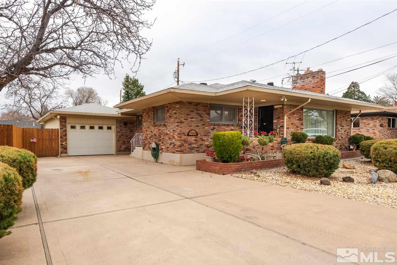 1270 Tacoma Way Reno, NV 89509 - Photo 1 of 24 a front view of a house with garage