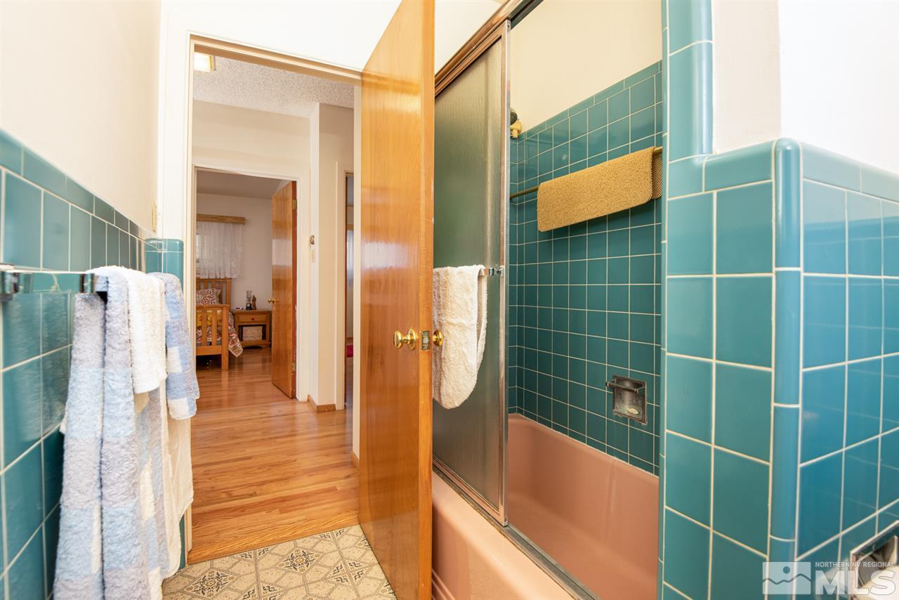 1270 Tacoma Way Reno, NV 89509 - Photo 11 of 24 a bathroom with a bathtub and shower