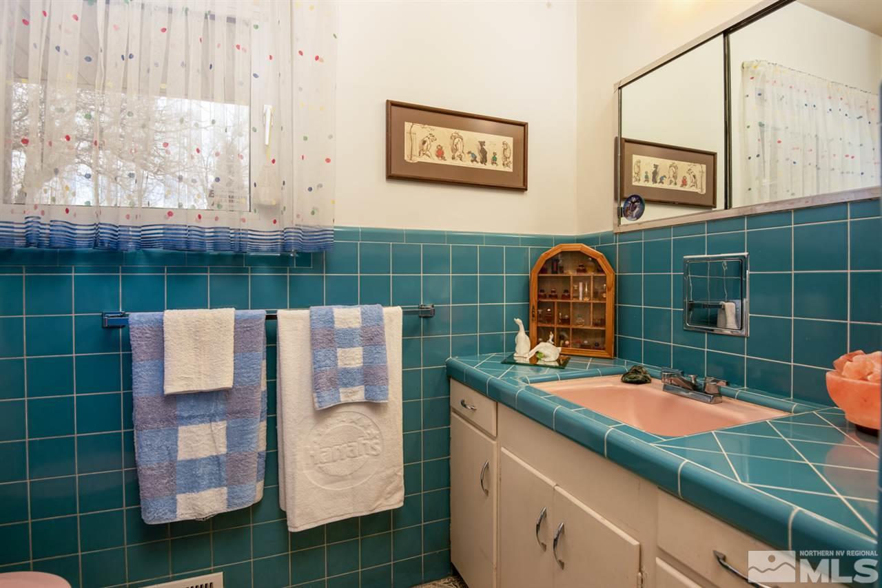 1270 Tacoma Way Reno, NV 89509 - Photo 12 of 24 a bathroom with a sink and mirror
