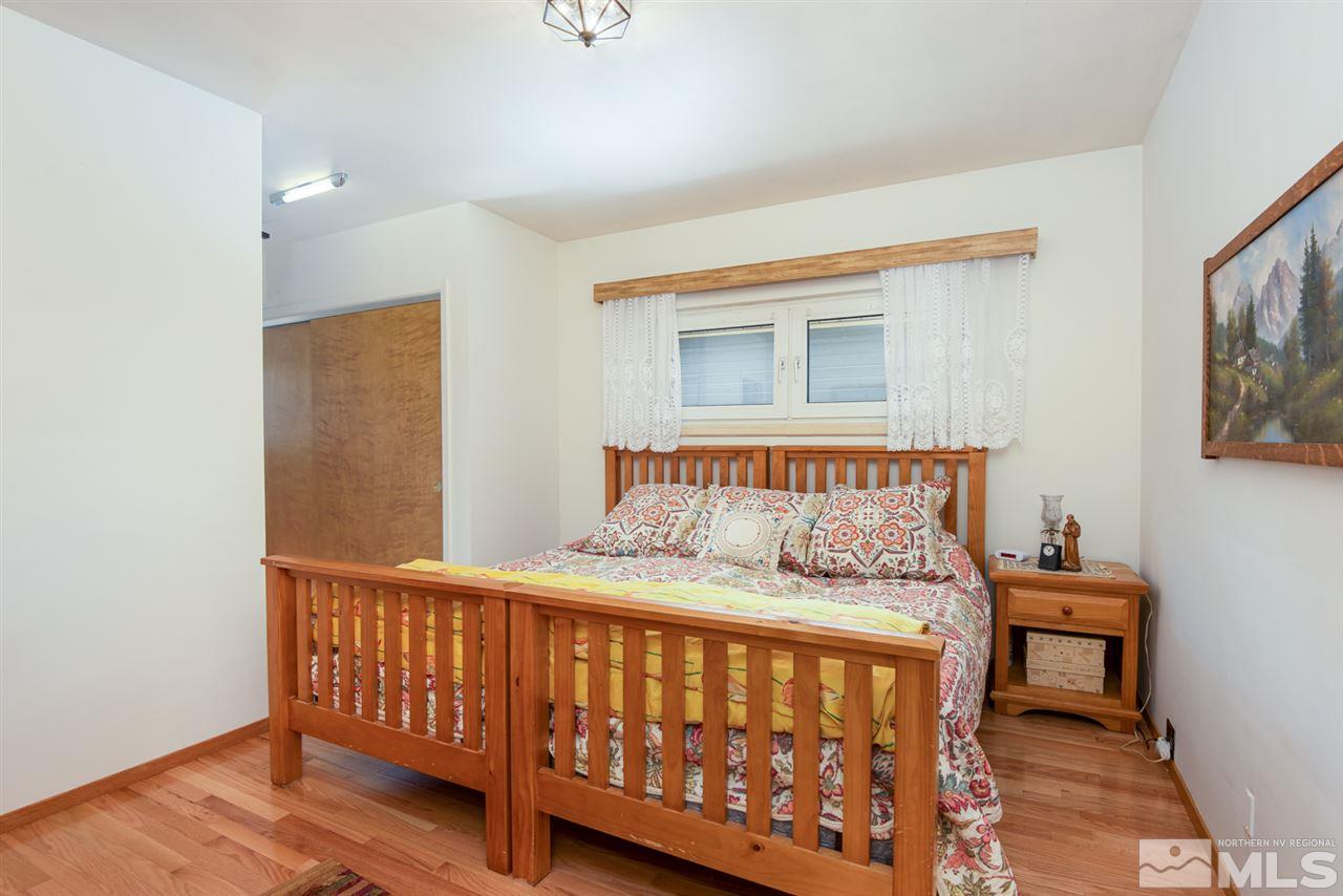 1270 Tacoma Way Reno, NV 89509 - Photo 16 of 24 a bedroom with a bed and a window
