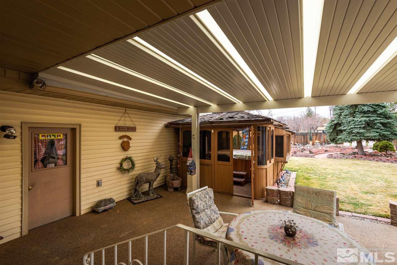 1270 Tacoma Way Reno, NV 89509 - Photo 19 of 24 a view of a porch with furniture and a yard
