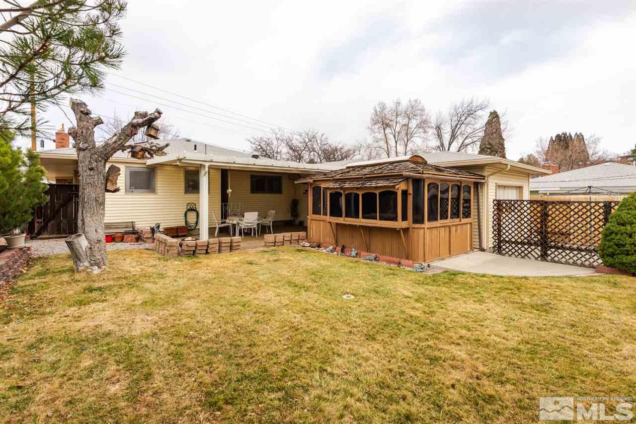 1270 Tacoma Way Reno, NV 89509 - Photo 22 of 24 a view of a house with pool and chairs next to a yard