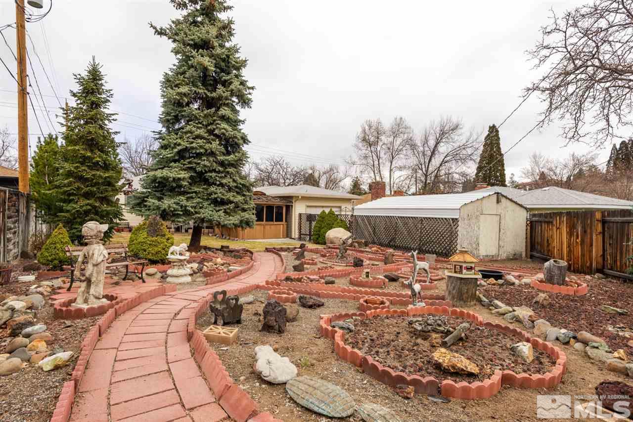 1270 Tacoma Way Reno, NV 89509 - Photo 24 of 24 a view of a patio with table and chairs under an umbrella