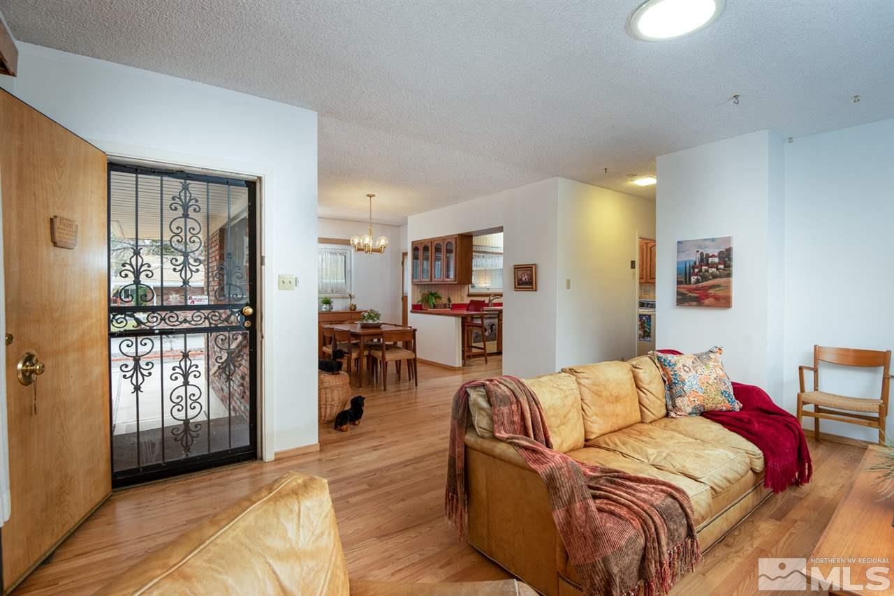 1270 Tacoma Way Reno, NV 89509 - Photo 3 of 24 a living room with furniture a refrigerator and kitchen view