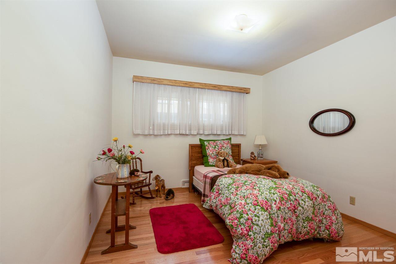 1270 Tacoma Way Reno, NV 89509 - Photo 10 of 24 a bedroom with bed and a window