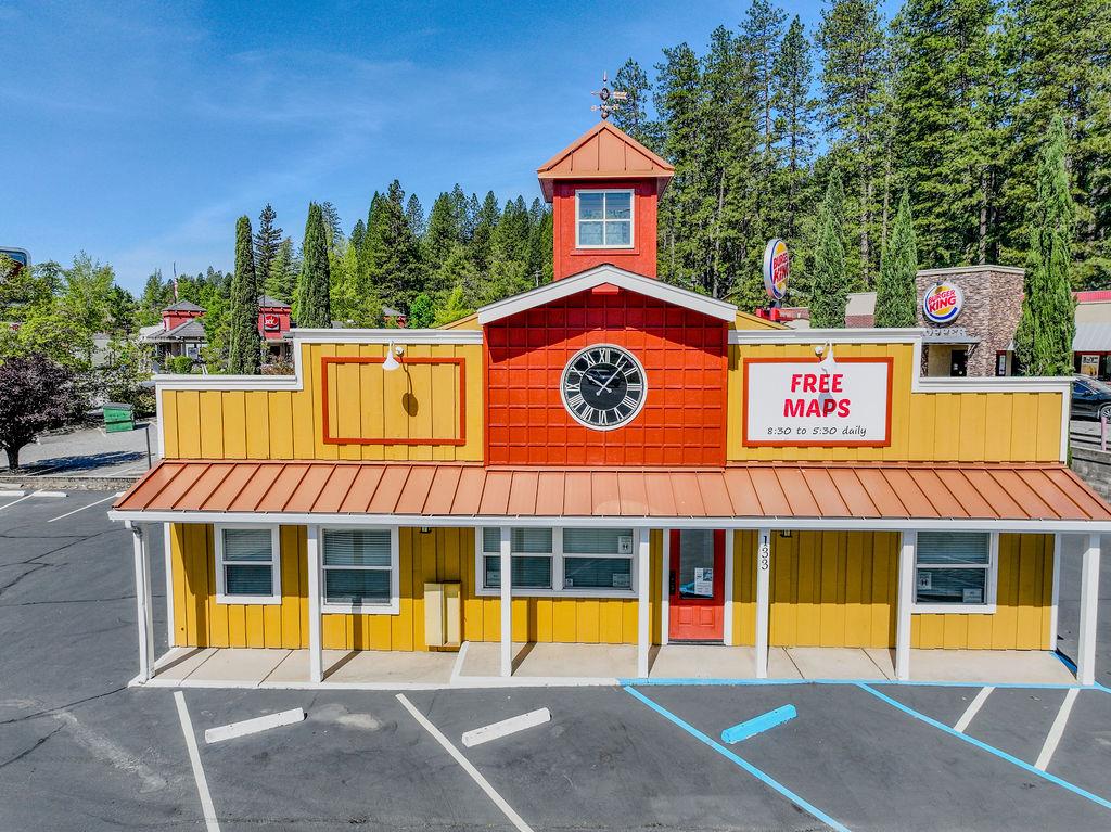 133 Brunswick Road Grass Valley, CA 95945 - Photo 22 of 47 a front view of a house with swimming pool and glass windows