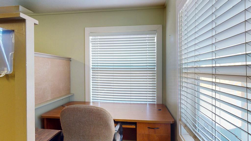 133 Brunswick Road Grass Valley, CA 95945 - Photo 7 of 47 a view of a room with a large window and wooden floor