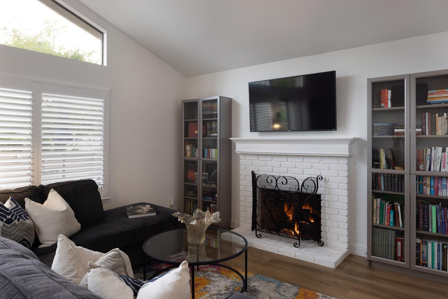 3850 Rio Road, Unit 63 Carmel, CA 93923 - Photo 4 of 19 a living room with furniture and a fireplace