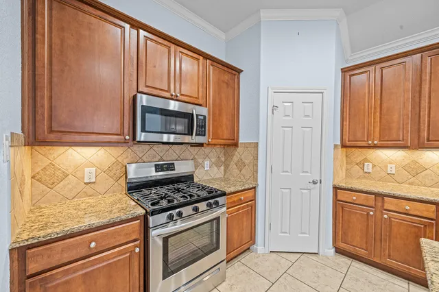 a spacious bathroom with a tub sink shower and mirror