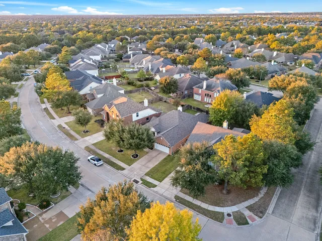 an aerial view of residential building with parking space