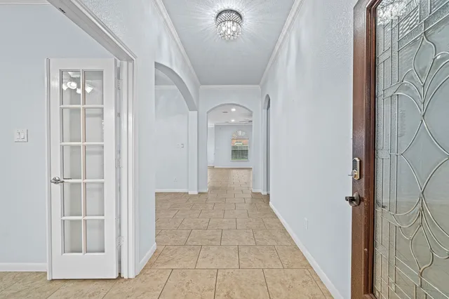 a large kitchen with stainless steel appliances granite countertop a sink and cabinets