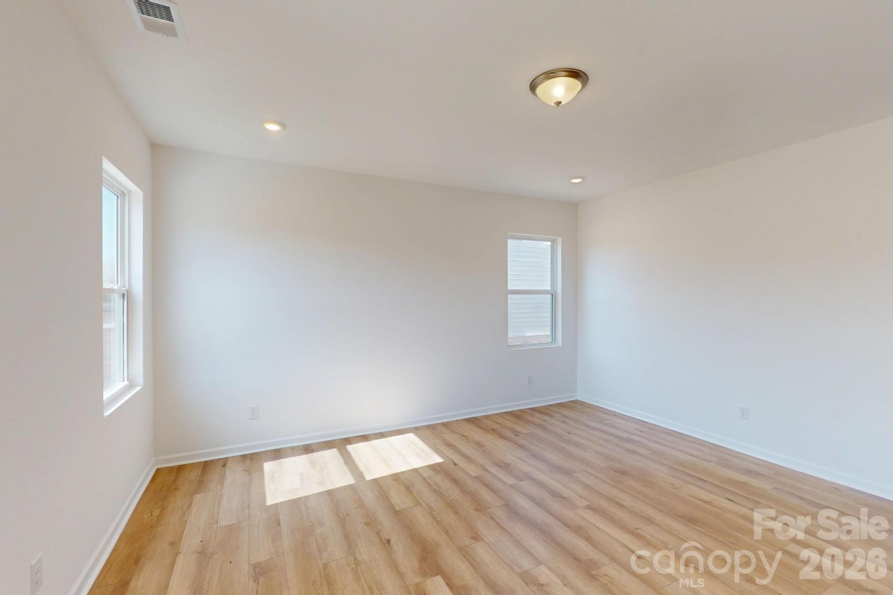 920 Barker Street Monroe, NC 28112 - Photo 15 of 36 wooden floor in an empty room with a window