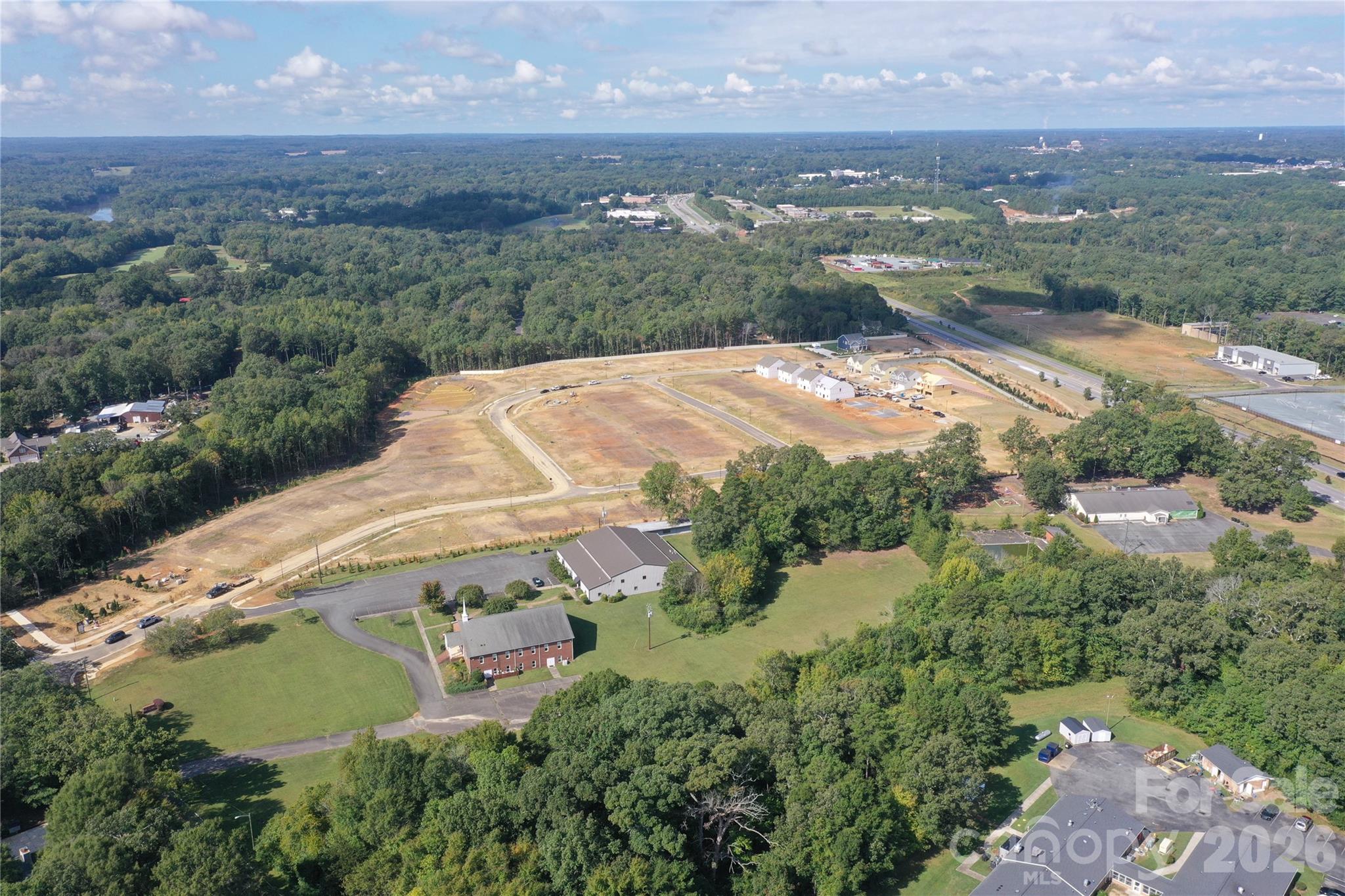 920 Barker Street Monroe, NC 28112 - Photo 36 of 36 an aerial view of a house with a yard and lake view