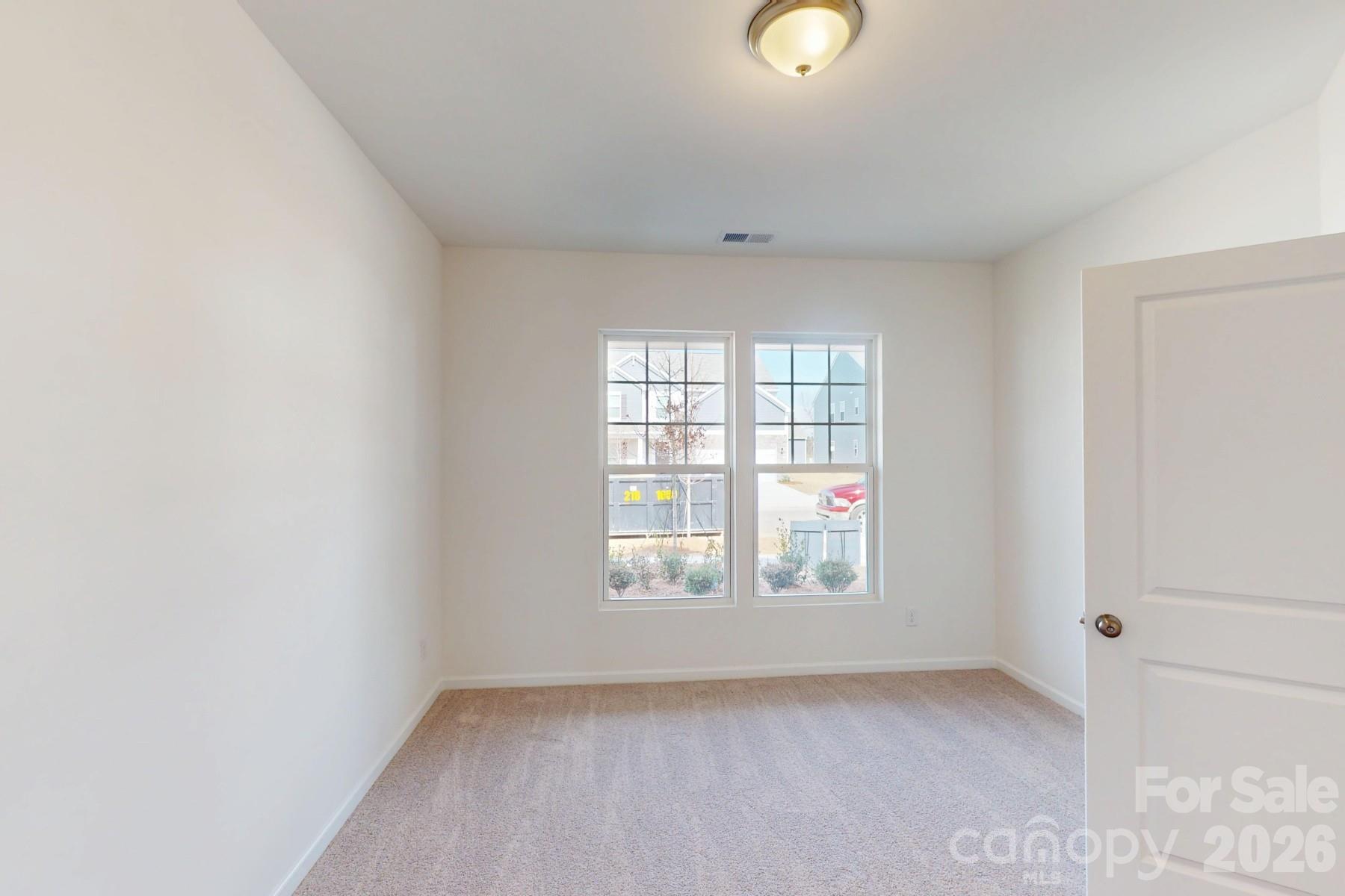 920 Barker Street Monroe, NC 28112 - Photo 5 of 36 an empty room with windows