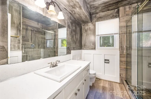 a bathroom with a sink and a large mirror