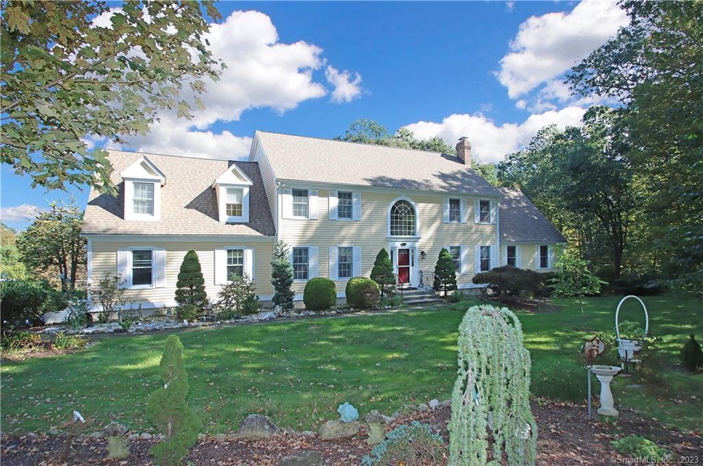 5 Castle Lane Newtown, CT 06470 - Photo 1 of 1 a front view of a house with garden