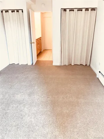 a bathroom with a toilet and a bathtub