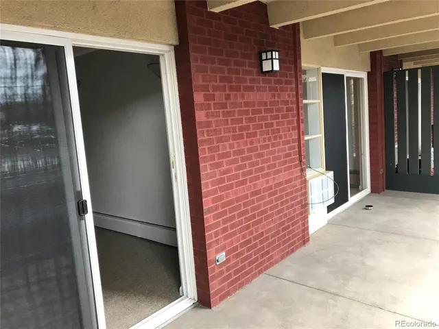 a view of a balcony with wooden floor