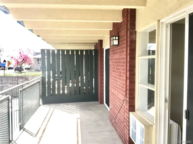 a view of swimming pool with outdoor seating and plants