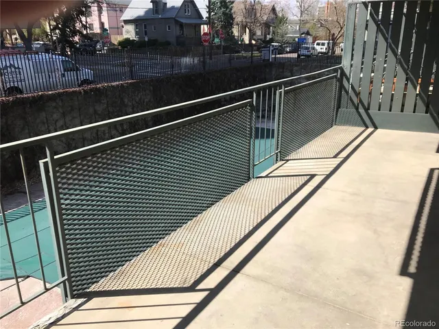 a view of a swimming pool with chairs in patio