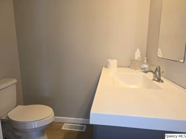 a bathroom with a sink and a toilet