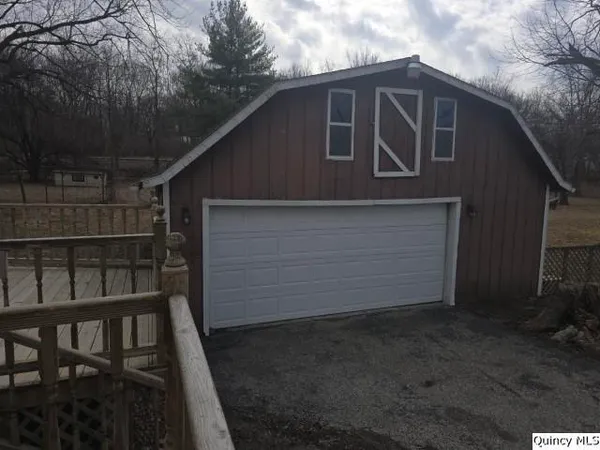 a front view of a house with garage