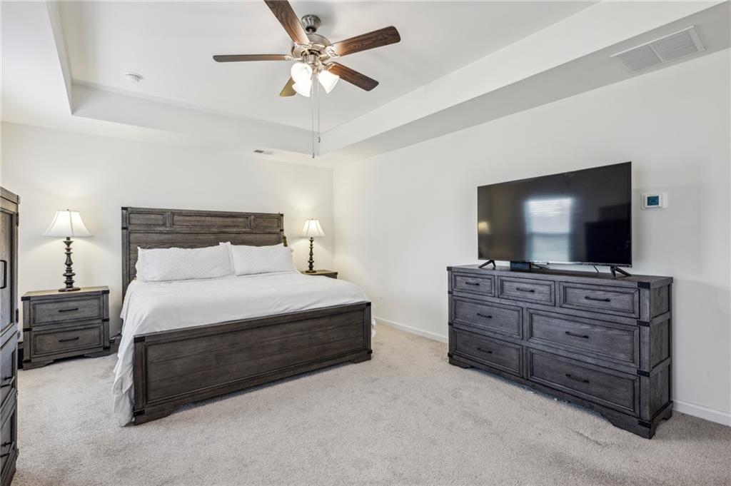 5320 Flat Rock Point Lithonia, GA 30038 - Photo 17 of 35 a bedroom with a bed and a flat screen tv