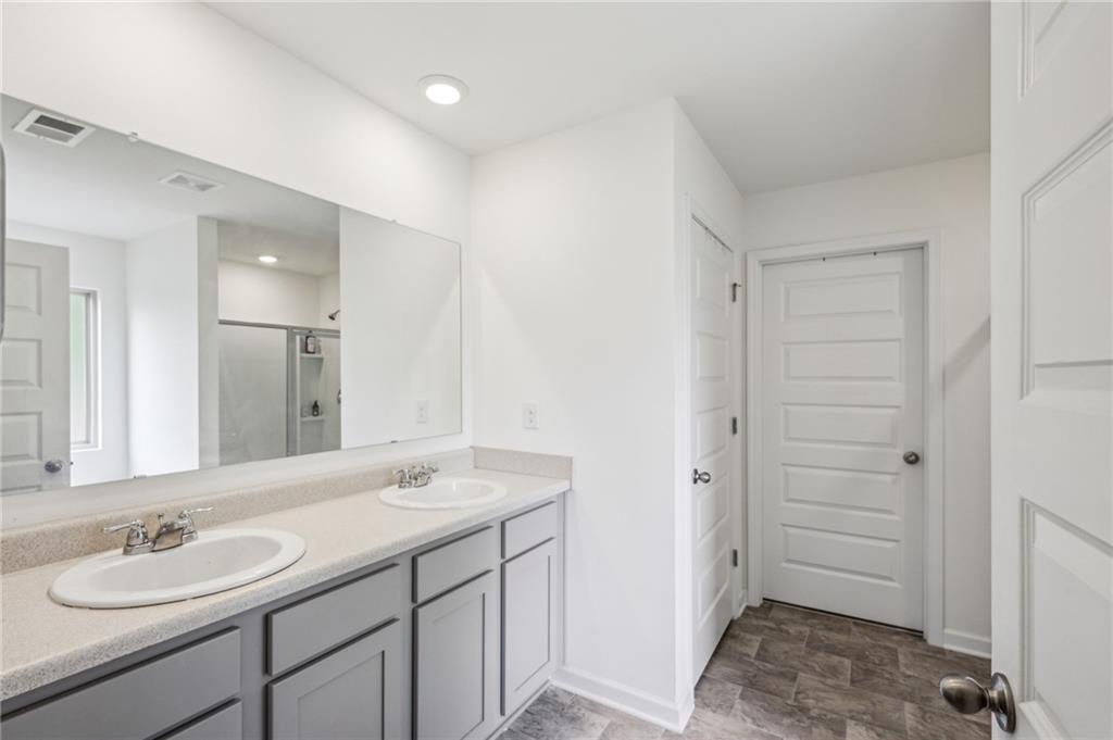 5320 Flat Rock Point Lithonia, GA 30038 - Photo 18 of 35 a bathroom with a sink and a mirror