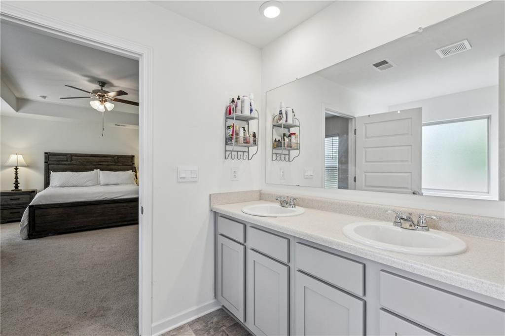 5320 Flat Rock Point Lithonia, GA 30038 - Photo 20 of 35 a bathroom with a sink and a mirror