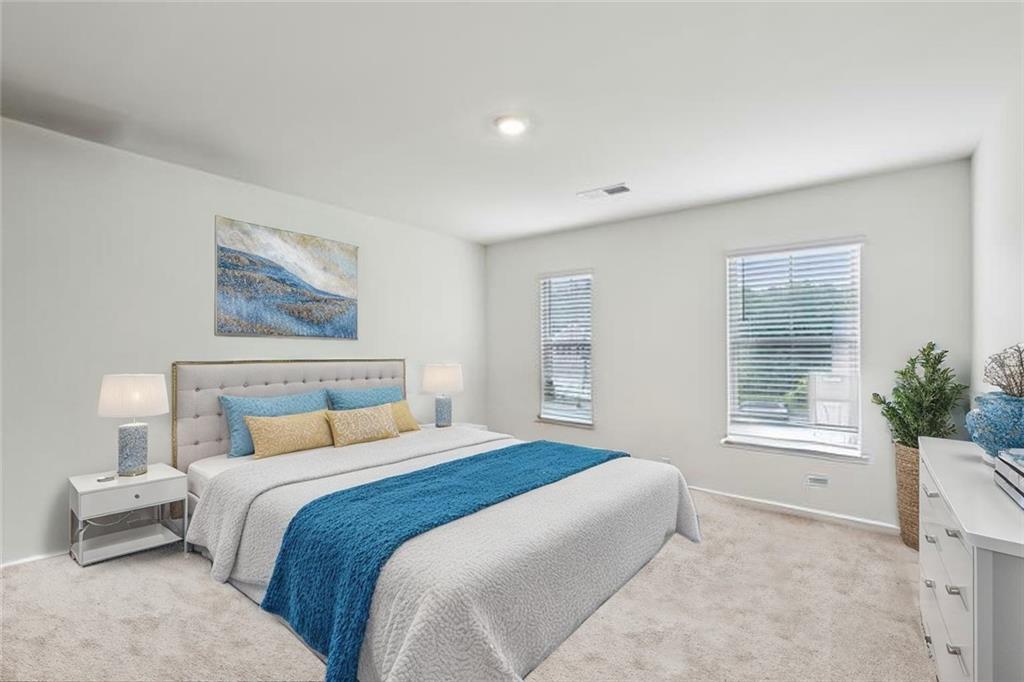 5320 Flat Rock Point Lithonia, GA 30038 - Photo 23 of 35 a bedroom with a bed and a potted plant