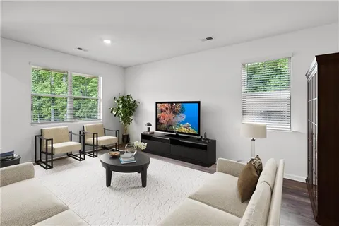 a living room with furniture or couch and a flat screen tv