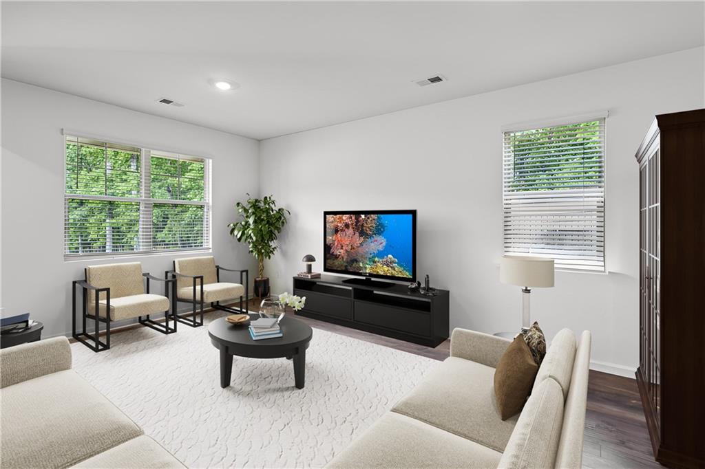 5320 Flat Rock Point Lithonia, GA 30038 - Photo 4 of 35 a living room with furniture or couch and a flat screen tv
