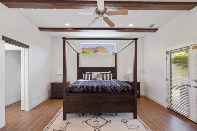 a bed room with a bed and a window