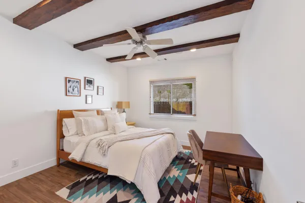 a bedroom with a bed and a table
