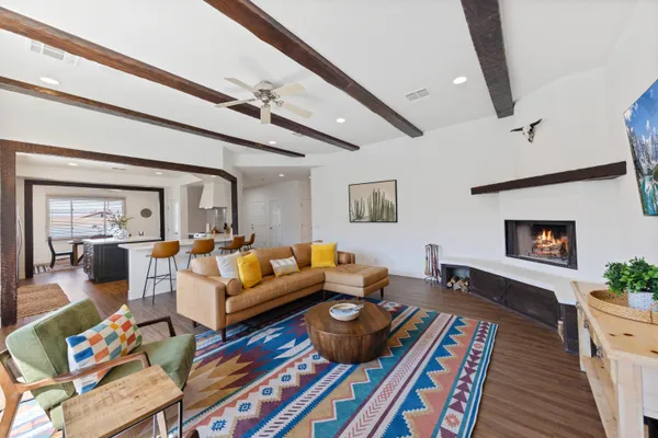 a living room with furniture fireplace and a flat screen tv