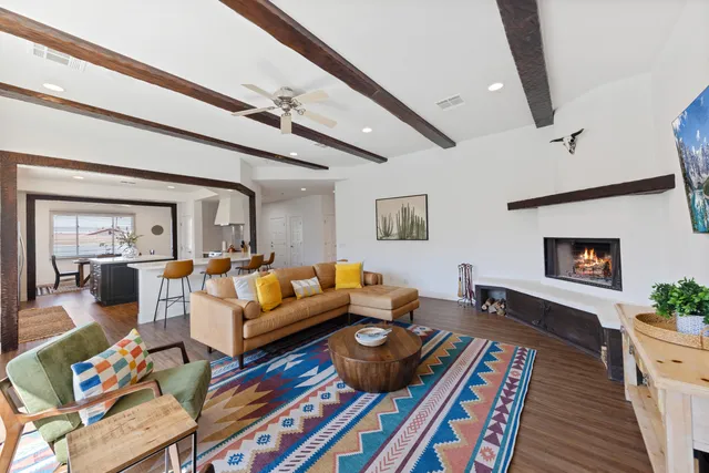 a living room with furniture fireplace and a flat screen tv