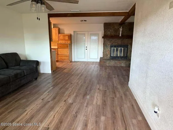 a view of livingroom with furniture and wooden floor